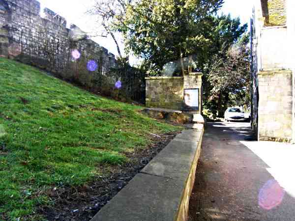 Looking along the lane and the medieval city wall towards the Museum Gardens.