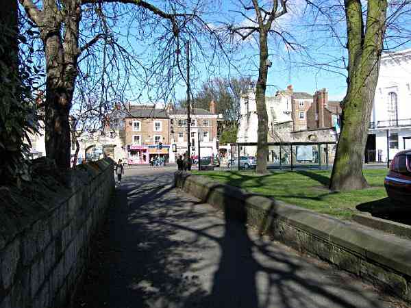 Looking along the lane and the medieval abbey wall towards Exhibition Square and Bootham Bar..