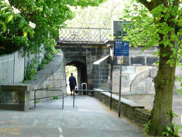 Looking north west along the south bank of the River Ouse, Scarborough Bridge immediately ahead.